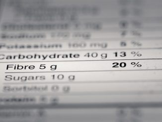 47053860 - shallow depth of field image of nutrition facts fiber information we can find on a grocery store product.