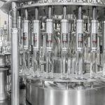 n the conveyor belt glass bottles. factory shop for the production of glass bottles and beverage