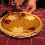 Pumpkin pie being cut open