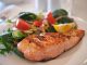 salmon on a plate. Fish consumption may prove highly beneficial for health.