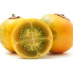 Ripe naranjilla on a white background.