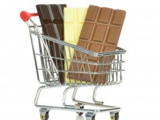 Three bars of chocolate in a shopping trolley. Chocolate is rich in cocoa polyphenols.