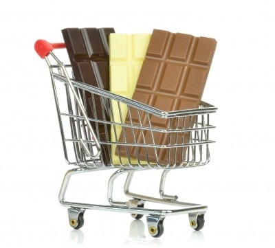 Three bars of chocolate in a shopping trolley. Chocolate is rich in cocoa polyphenols.