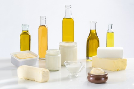 Culinary variety of fats on white background. Stability of edible oils is a key necessity where ever they are used.