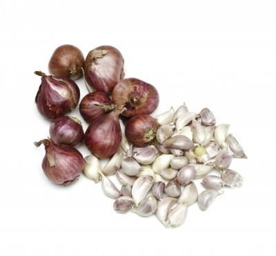 Garlic bulbs and cloves on a white background