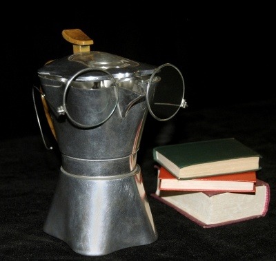 Coffee pot with glasses and books