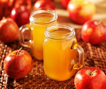 Cider apples used to make a hot cider beverage, stored in mason jars.