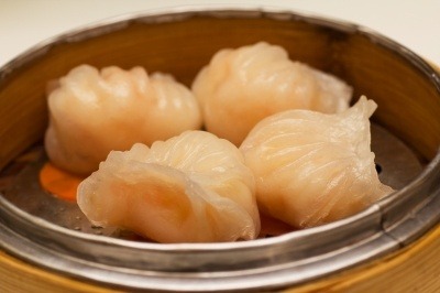 Shrimp dumplings in a pot, ready to eat.