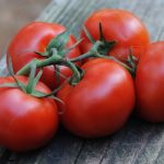 Five plump and juicy vine-ripened tomatoes