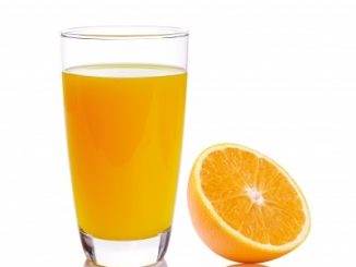 A glass of orange juice and a half of orange. Helps cognitive function in the elderly
