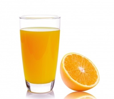 A glass of orange juice and a half of orange. Helps cognitive function in the elderly