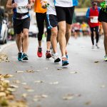 marathon running race, people feet on autumn road