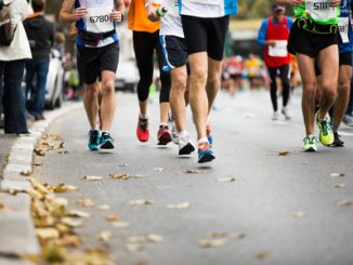 marathon running race, people feet on autumn road