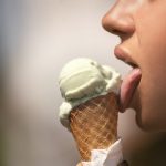 A girl licking an ice-cream. Quantitative Descriptive Analysis (QDA) is one way of being objective about the sensory profile of this type of product. A typical food emulsion.