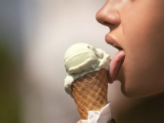 A girl licking an ice-cream. Quantitative Descriptive Analysis (QDA) is one way of being objective about the sensory profile of this type of product. A typical food emulsion.