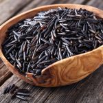Wild rice in a wooden bowl.