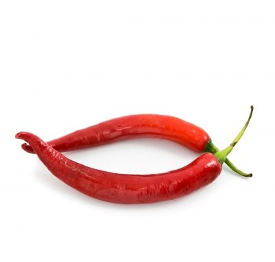 Two whole red chilli peppers on a white background.