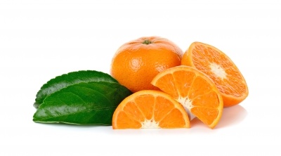 Carotenoids provide wonderful vibrant colour in these orange segments. There is a whole orange and green leaf on a white background.