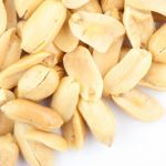 Salted peanuts on white background