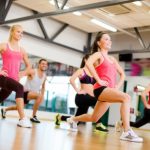 24117789 - fitness, sport, training, gym and lifestyle concept - group of smiling people exercising in the gym