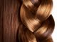 Braid hairstyle - brown long hair close up -healthy hair.