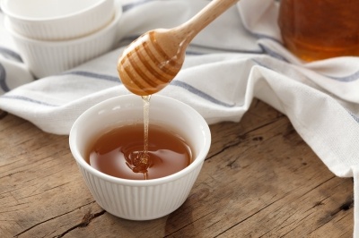 A honey dipper. Natural contaminants can be found in honey but we wouldn't always know it.