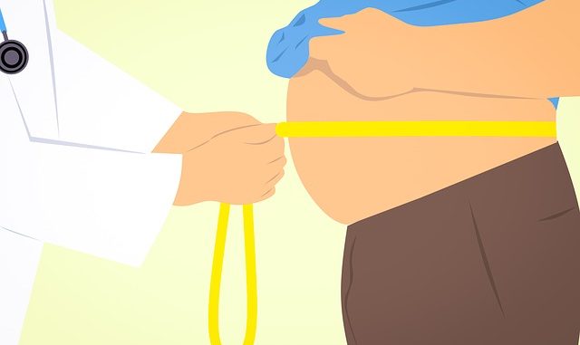 cartoon of a man's waist being measured by a doctor. Obesity is a symptom of metabolic syndrome.