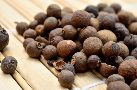 allspice on wooden table