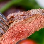 10644207 - new york strip steak with vegetables. Containing blood from beef cattle.