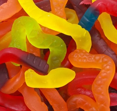 Multicoloured gummy snakes in full view.