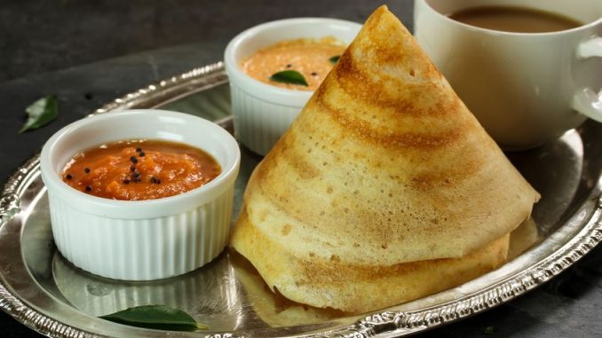 Cone shape masala dosa with sambar and chutney, south Indian breakfast