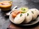 Idly sambar or Idli with Sambhar and green, red chutney. Popular South indian breakfast