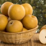 Some asian pears over a wooden surface. Fresh fruits
