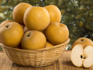 Some asian pears over a wooden surface. Fresh fruits