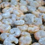 Shrimps and prawns cooking in a pan.