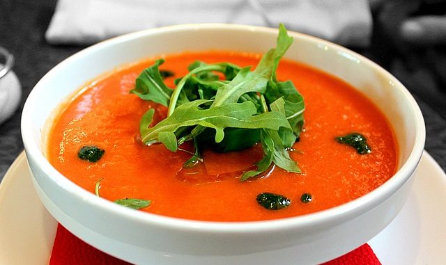 Tomato Gazpacho soup in a white bowl.