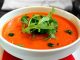 Tomato Gazpacho soup in a white bowl.