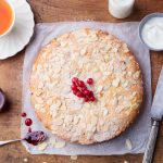 Almond and raspberry cake, Bakewell tart. Traditional British pastry. Wooden backgraund. Top view