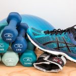 Training shoes, dumbbells, blue weights ball and all for exercising with to reduce muscle atrophy.