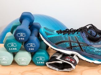 Training shoes, dumbbells, blue weights ball and all for exercising with to reduce muscle atrophy.