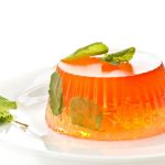 Colorful fruit jelly sweets on a white plate