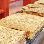 Traditional Iranian Sangak Bread topped with sesame seeds and sunflower seeds. Widespread type of Persian bread.