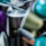 Colored coffee capsules blurred for background