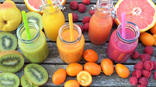 Smoothies in different colours on a board. An example of diet drinks with various fruits surrounding the glasses. Increased health risk for post-menopausal women?