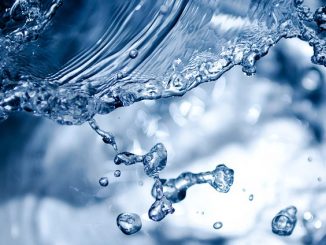 A splash. Could be low-acid or alkaline water or just plain old water. A variety of functional water is possible.
