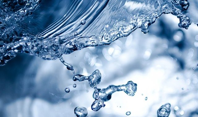 A splash. Could be low-acid or alkaline water or just plain old water. A variety of functional water is possible.
