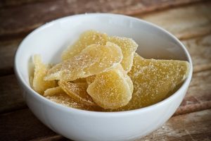 Crystallized ginger in a white bowl.