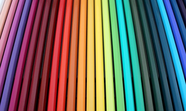 Pencils lined up according to the colour spectrum.