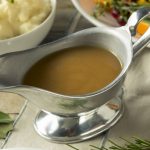 Hot Brown Organic Turkey Gravy in a Boat. The product of how to make gravy.