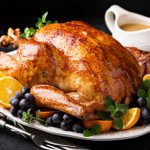 Festive celebration roasted turkey with gravy for Thanksgiving or Christmas